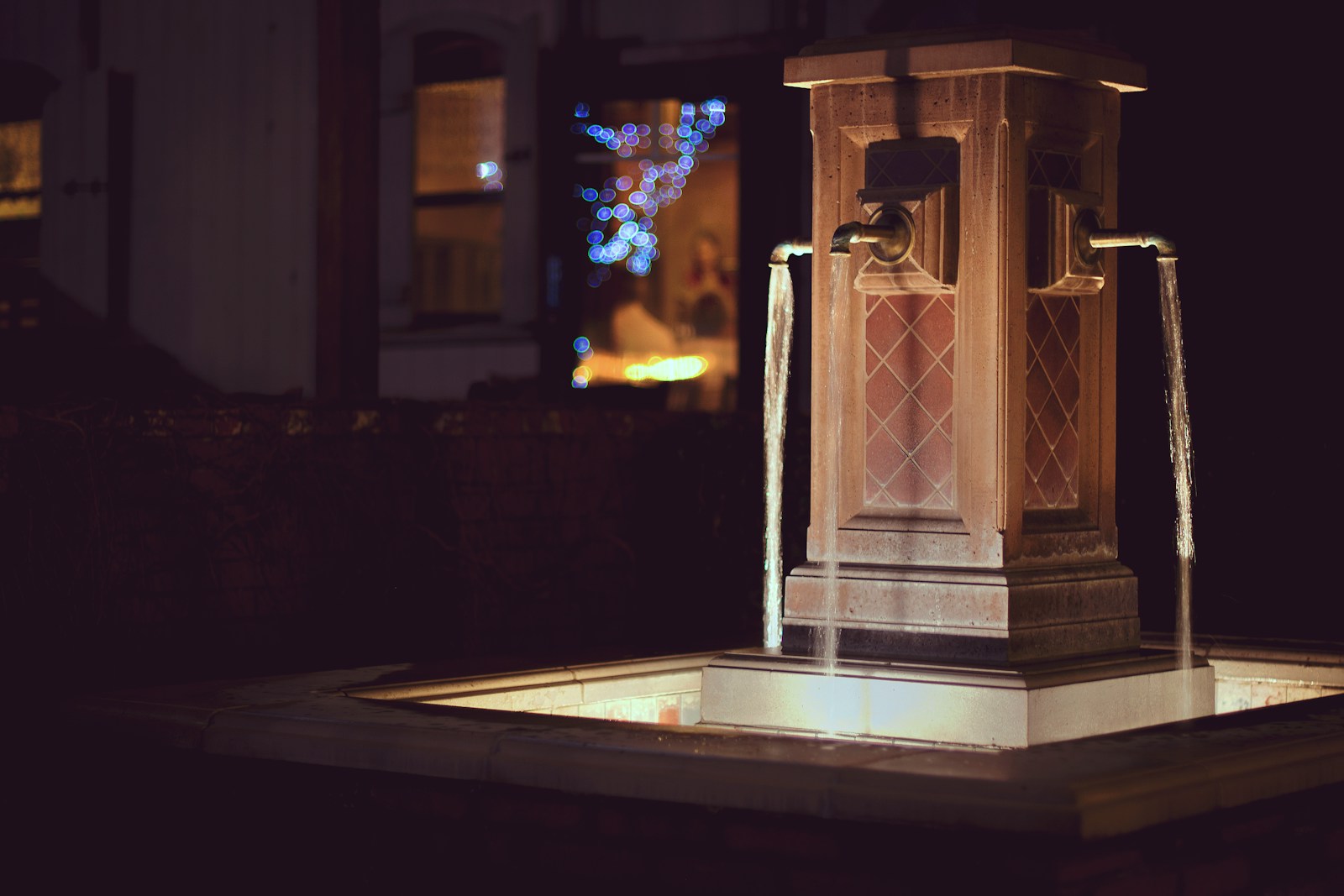 closeup photo of outdoor water fountain at nighttime