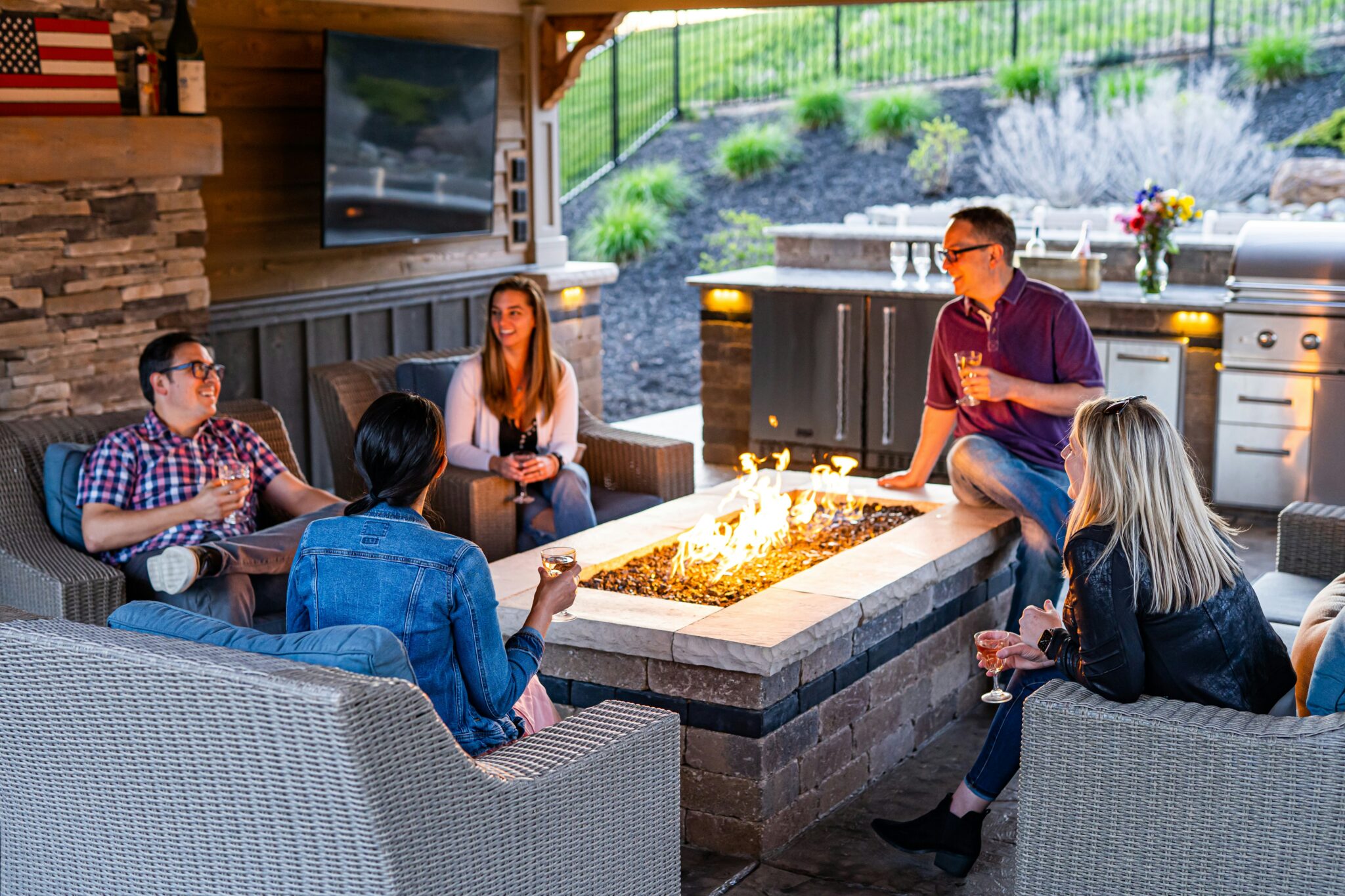People gathering around a firepit